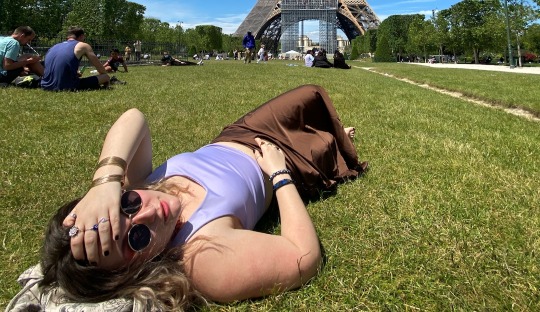 GA Tech Europe student laying on the grass in the sun