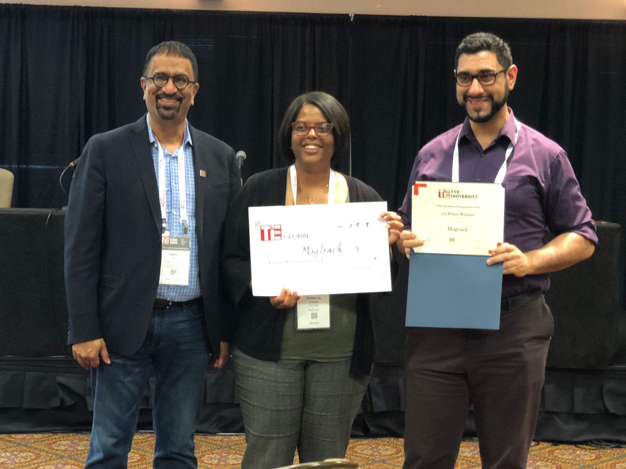 Rebecca Royster (center) and Nordine Sebkhi (right) are pictured with Nitin Rai, chairman of the board of trustees with TiE Global, at the TiE Young Entrepreneurs (TYE) University Global Pitchfest Competition. 